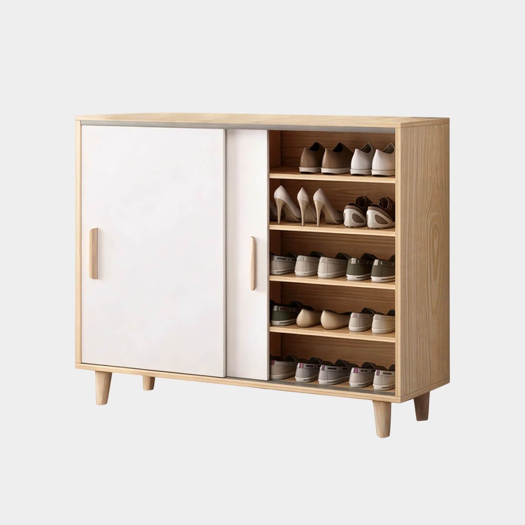Meuble à chaussures en MDF bois clair et blanc intégré dans une entrée moderne au style scandinave.